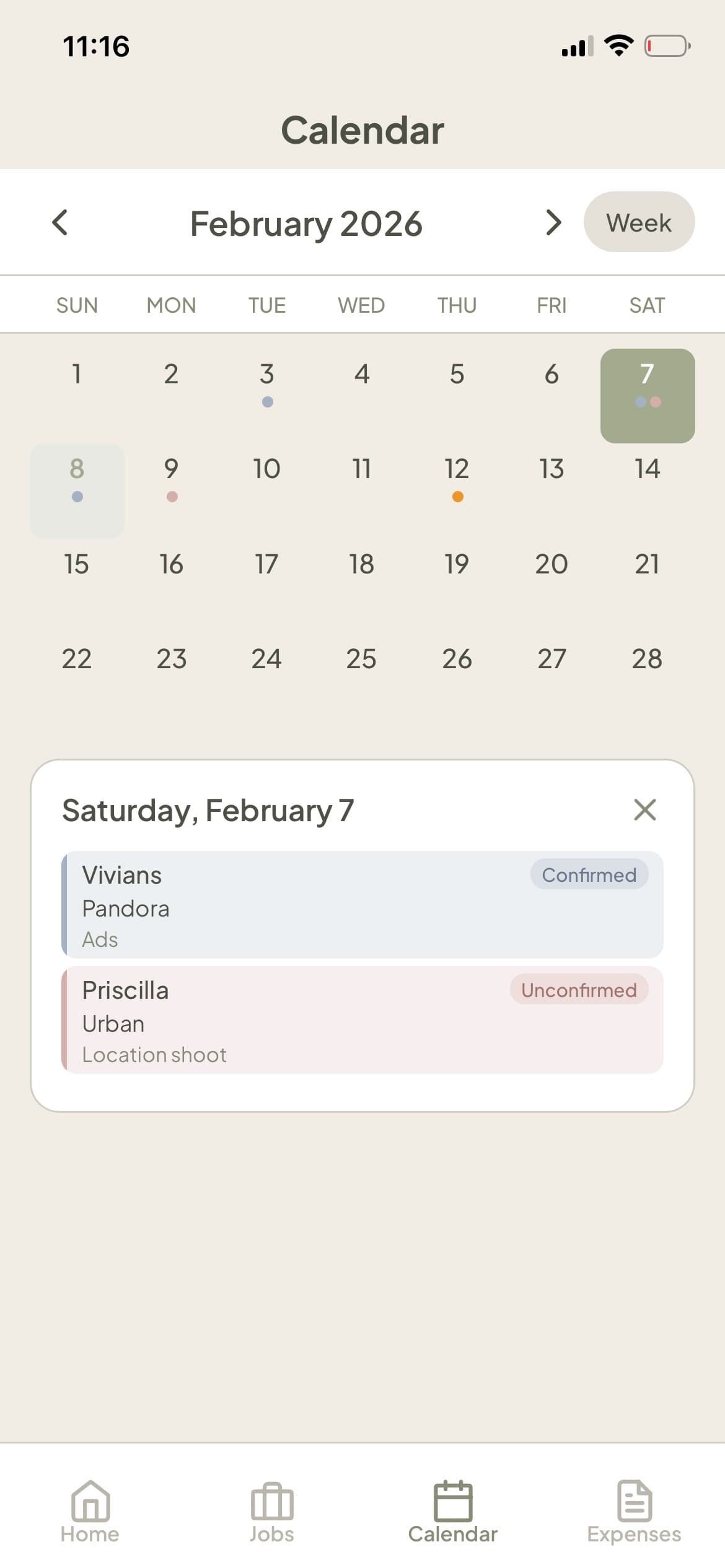 BOOKDU calendar month view showing confirmed and unconfirmed modeling jobs